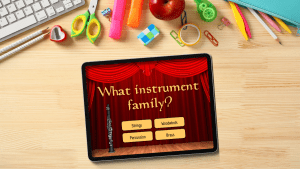 A tablet screen displaying a question: "What instrument family?" with four answer choices: Strings, Woodwinds, Percussion, and Brass.