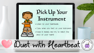 Image vividly displays a music class activity on a laptop which has students create a duet on a classroom instrument along with the steady beat of their heart. Music lesson activity is available free to members of the Chamber of Freebies.