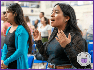 Image showing upper elementary music students singing passionately in music class.