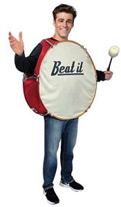 Music teacher wearing a bass drum costume with the words “Beat It” on the drumhead, holding a mallet for a humorous Halloween outfit.